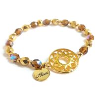 Pulsera elástica cristal de roca topaz y dorado con conector de aro filigrana baño oro