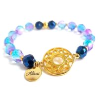 Pulsera elástica cristal de roca azul y aro filigrana baño oro