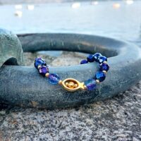 Pulsera Bocarte con conector pez baño oro y cristal de roca