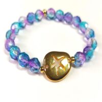 Pulsera conector estrella de mar baño oro y cristal de roca de 8 mm.